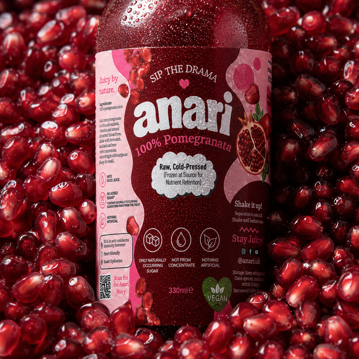 ANARI bottle nestled in ruby pomegranate seeds